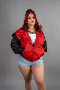 Style a varsity jacket in Las Vegas street setting 