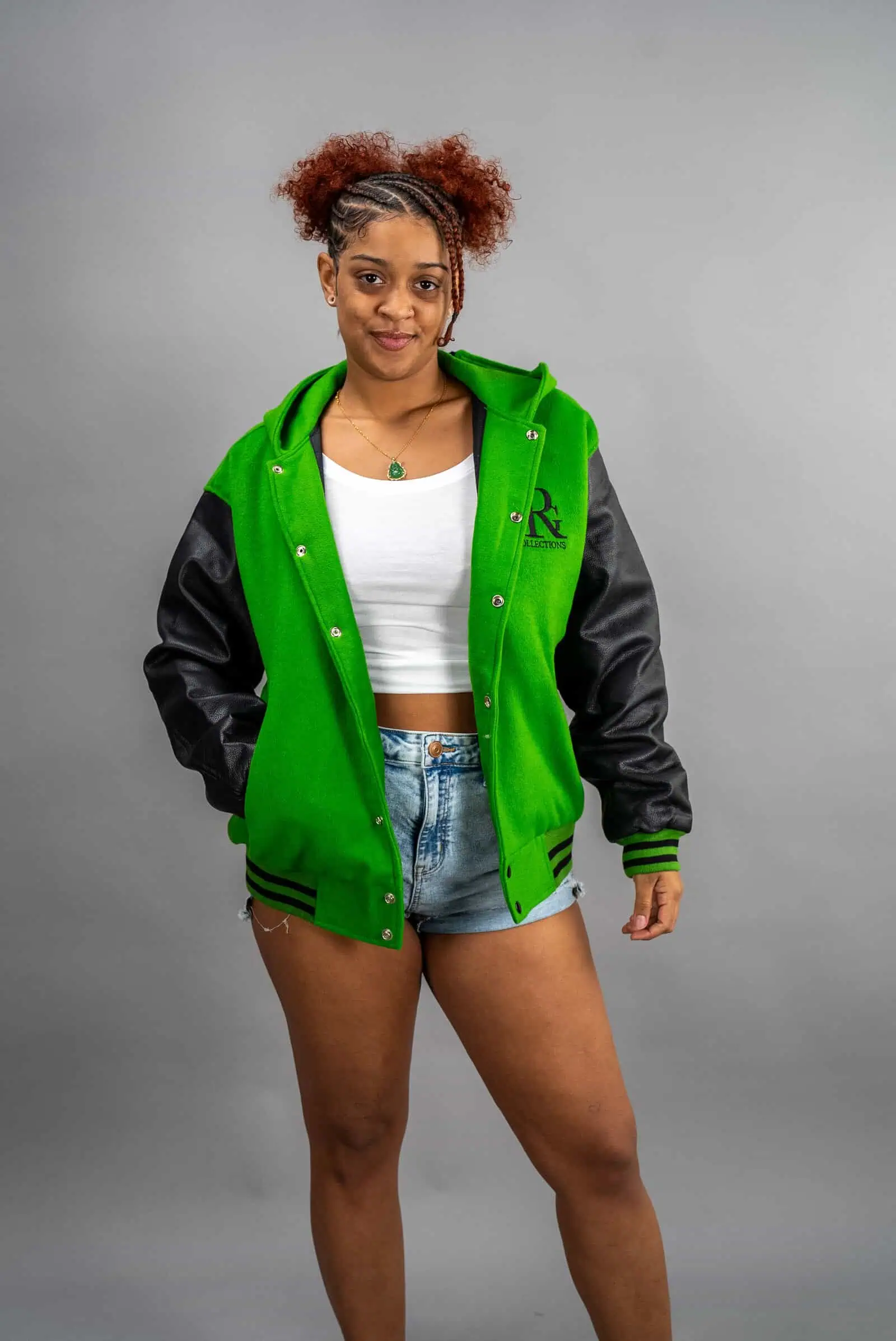 Reign Gear women's green and black water-repellent varsity jacket
